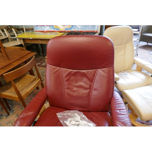 427 - Stressless reclining chair together with matching footstool - Burgundy