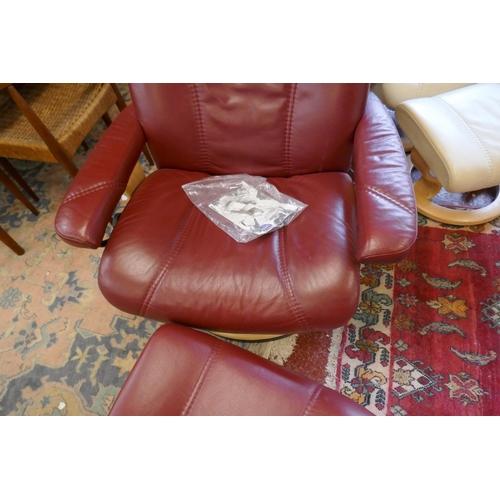 427 - Stressless reclining chair together with matching footstool - Burgundy