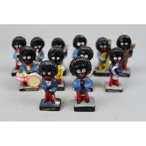 141 - 12 Robinson Jolly Golly band figurinesThese items are listed on the basis they are illustrative of a... 