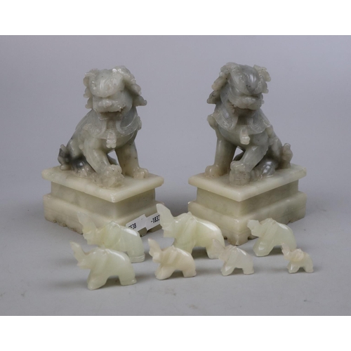 219 - Pair of carved soapstone dog of Foo together with carved elephants