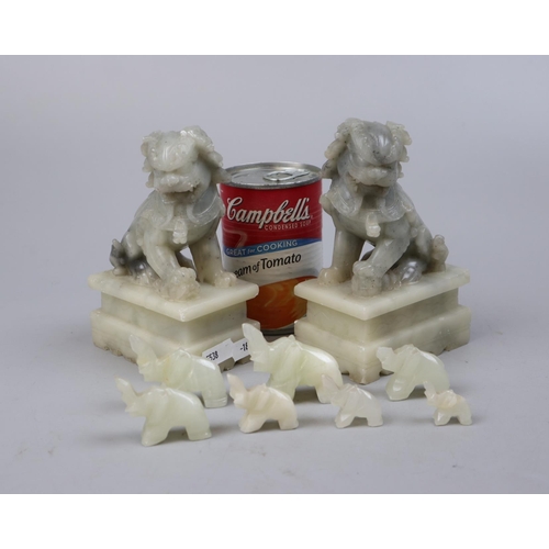 219 - Pair of carved soapstone dog of Foo together with carved elephants