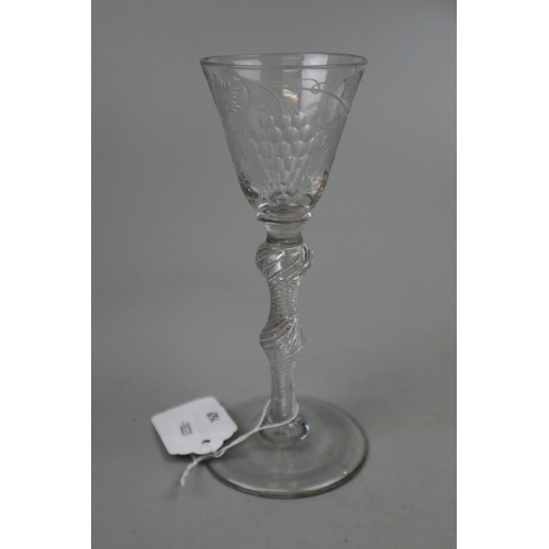 221 - Georgian wine glass with round funnel bowl on double knopped air twist stem with conical foot