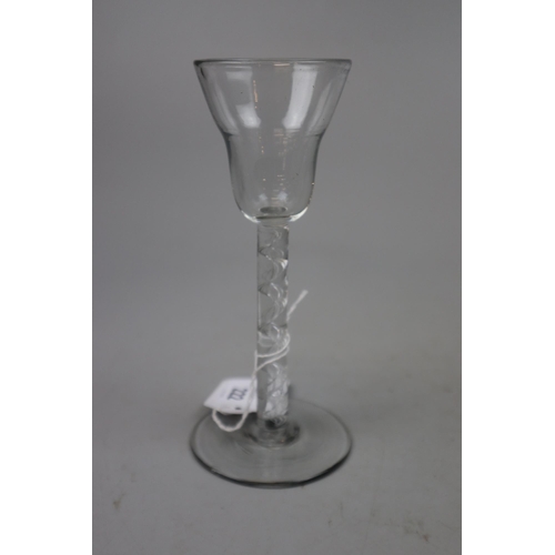 222 - Georgian wine glass with pan top on a multi-strand open spiral stem with conical foot