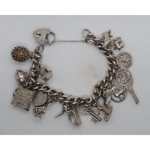 62 - Silver charm bracelet - Approx weight 81g