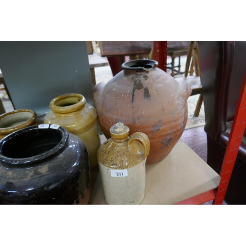 311 - Quantity of 8 earthenware pots together with small stand