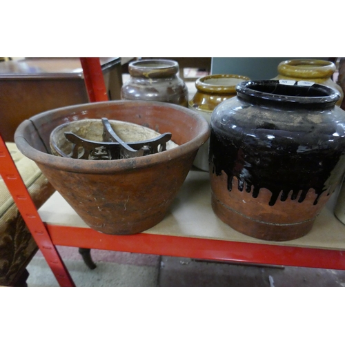 311 - Quantity of 8 earthenware pots together with small stand