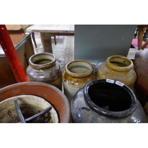 311 - Quantity of 8 earthenware pots together with small stand