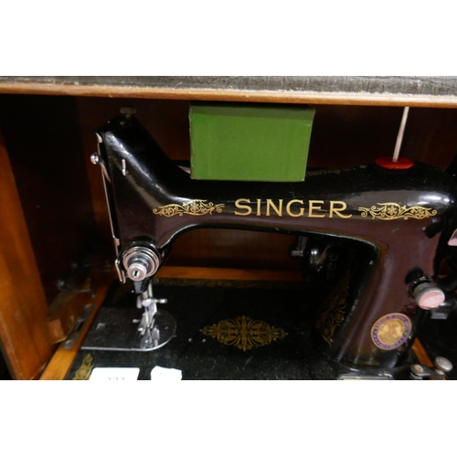 323 - Electric singer sewing machine in case with accessories