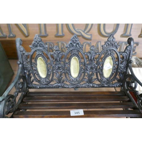 345 - Miniature cast iron garden bench