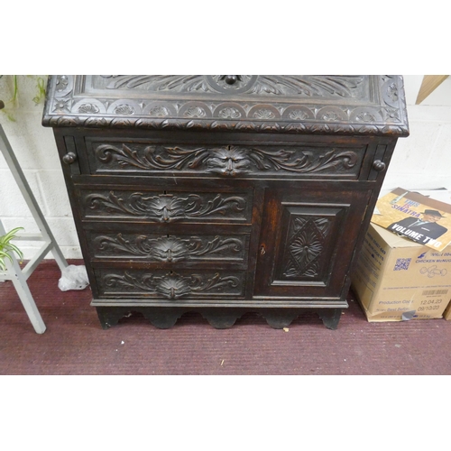 393 - Ebonised oak green man bureau 