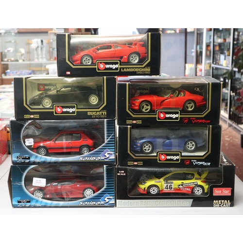 149 - Collection of 7 scale model cars to include Burago and Selido