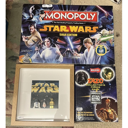 186 - Sealed Star Wars Monopoly game together with Tazo collectors pack and framed Lego droids