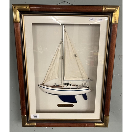 282 - Boxed framed model of a yacht