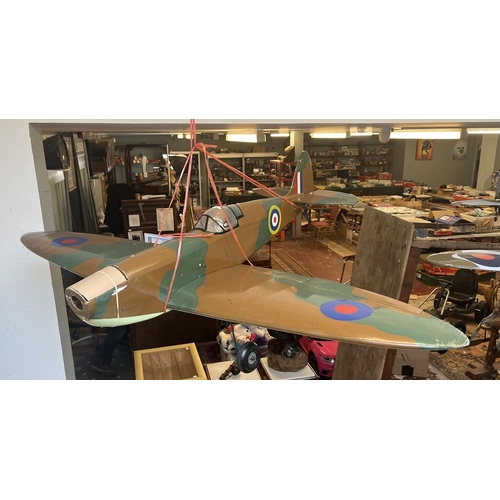 349 - Radio controlled model of a Spitfire with servers. Wing width 142cm, length of fuselage 107cm