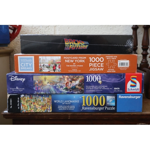 354 - 4 1000 piece jigsaws to include Disney Little Mermaid, Postcard from New York and world landmarks by... 