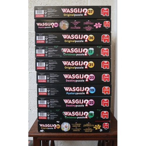 355 - 10 boxed WASGIJ (jigsaw puzzles). Some Christmas & New Year