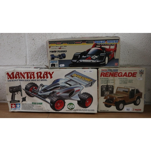 402 - Collection of remote control cars to include Tamiya