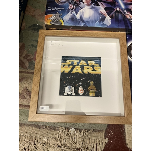 186 - Sealed Star Wars Monopoly game together with Tazo collectors pack and framed Lego droids