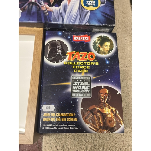 186 - Sealed Star Wars Monopoly game together with Tazo collectors pack and framed Lego droids