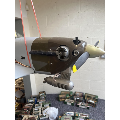 348 - De-Agostini R.C. Spitfire 1:10 scale including transmitter together with the original magazines in b... 