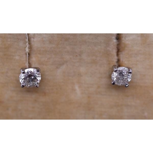 76 - Pair of 18ct white gold diamond stud earrings