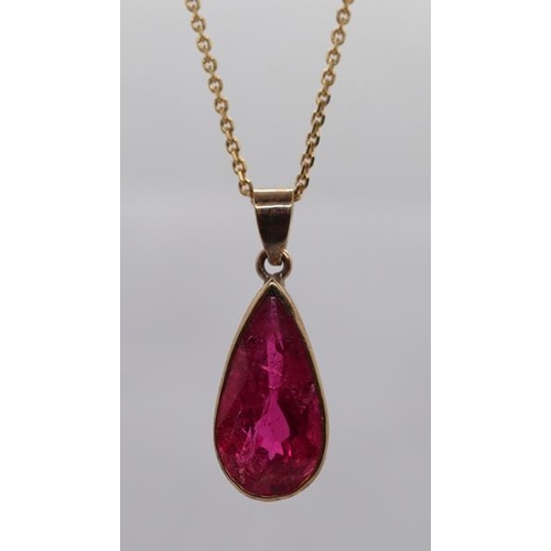 93 - 9ct gold pendant set with 5.57ct rubellite on 9ct gold chain