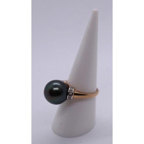 79 - 9ct gold black pearl and diamond ring - Size N