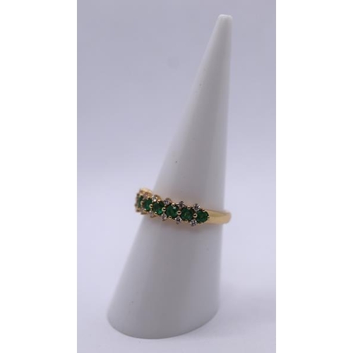 81 - 18ct gold emerald and diamond set ring - Size M
