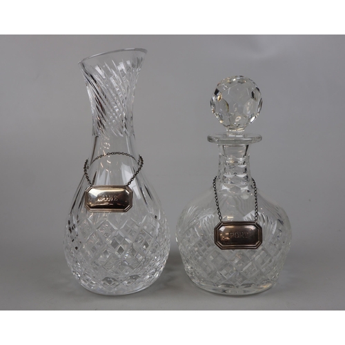 164 - 2 decanters with collars - one silver