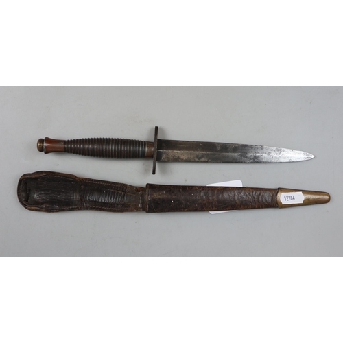 182 - Fairbairn Sykes style fighting knife with leather sheath