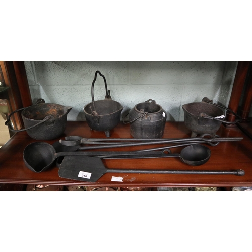 216 - Collection of blacksmiths tools together with smelting pots and glue pot