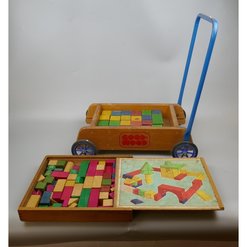 338 - A vintage Childs push trolley with building blocks together with extra set of building blocks