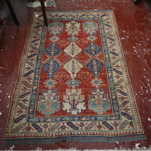 625 - Red and blue patterned rug - Approx size: 176cm x 127cm