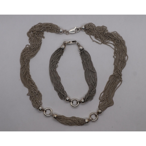 68 - Silver necklace with matching bracelet