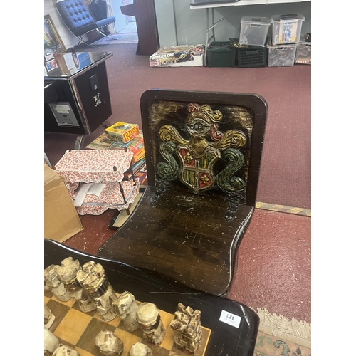 305 - Bespoke carved chess table with 2 matching folding chairs together with carved chess pieces in drawe... 