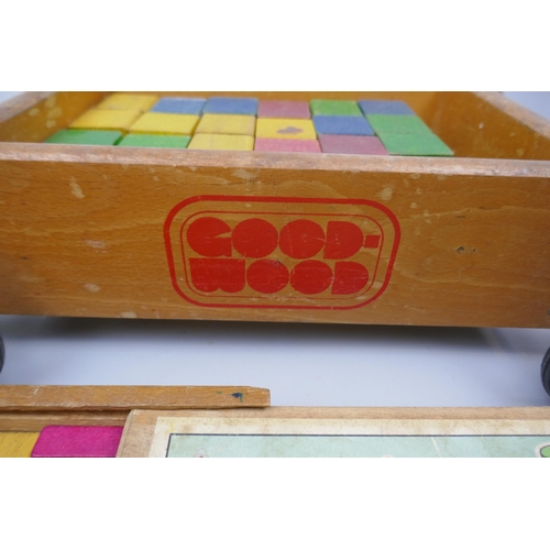 338 - A vintage Childs push trolley with building blocks together with extra set of building blocks