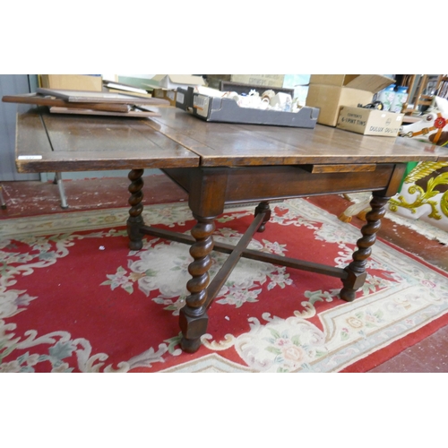 347 - Oak draw leaf table on barley twist legsL: 183cm when open 106cm when closed approxW: 99cm approxH: ... 