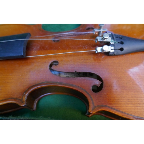 557 - 2 violins in cases