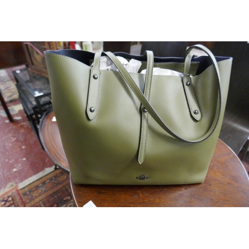 613 - Green leather handbag by Coach with original receipts together with a Ralph Lauren handbag with orig... 