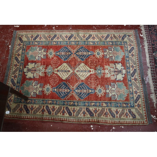 625 - Red and blue patterned rug - Approx size: 176cm x 127cm