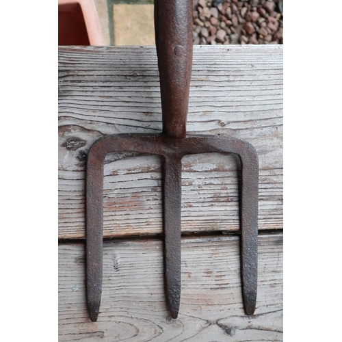 633 - Galvanised watering can together with vintage potato fork