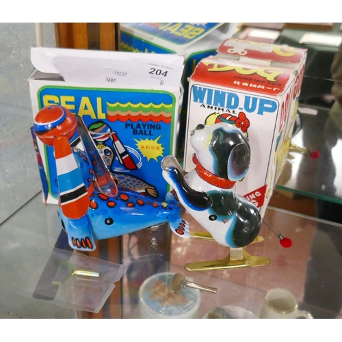 204 - 2 wind up tin plate toys