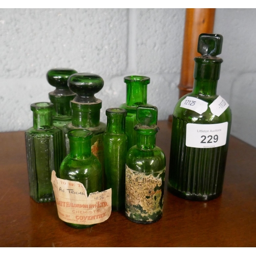 229 - Collection of apothecary green glass bottles