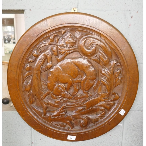 343 - Large circular carved oak wall plaque of a dog