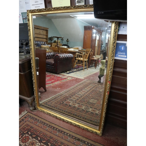486 - Large gilt framed bevelled mirror