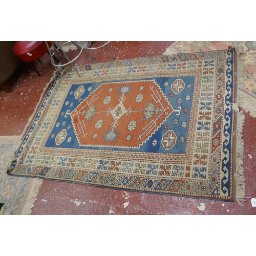 512 - Orange & blue patterned rug - Approx size: 194cm x 126cm