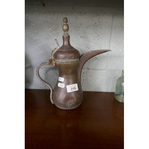 219 - East African Arab coffee pot together with an East African pot with original banana leaf stand