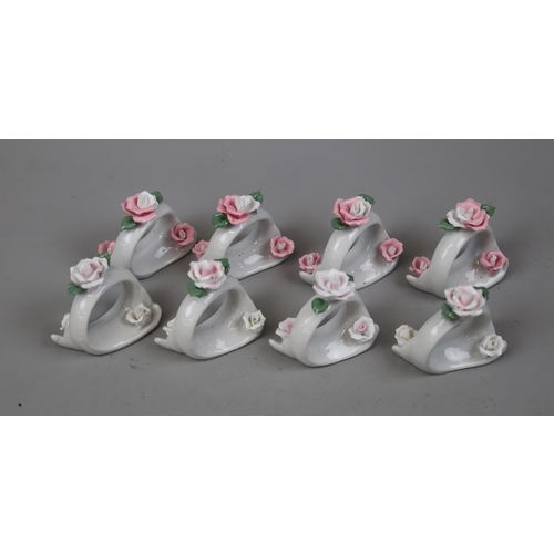 123 - 8 ceramic napkin rings adorned with roses