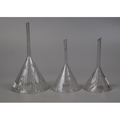 143 - 3 Georgian glass decanter funnels 