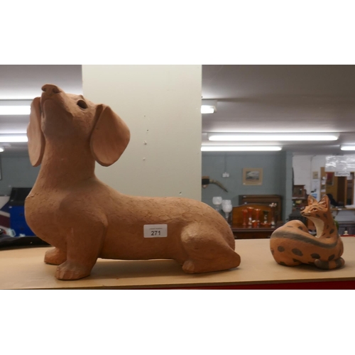 271 - Terracotta Dachshund dog by Dora Barrett 'RA' together with another - Approx height 29cm